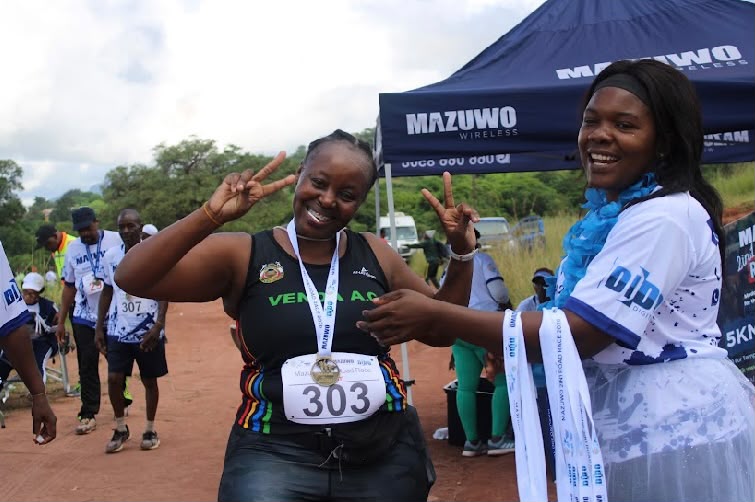 Community participant and Mazuwo Wireless representative at the Three-in-One event